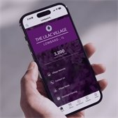 hand holding smartphone displaying seeclickfix homepage 