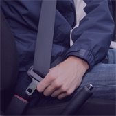 photo of person buckling their seatbelt