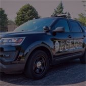 close up of black Lombard Police squad car parked on the street