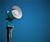 photo of outdoor siren and blue sky