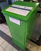 photo of green prescription medication drop box in police station lobby