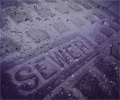 photo of sewer cover with rainfall 
