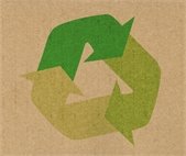 photo of cardboard with recycling symbol overlay