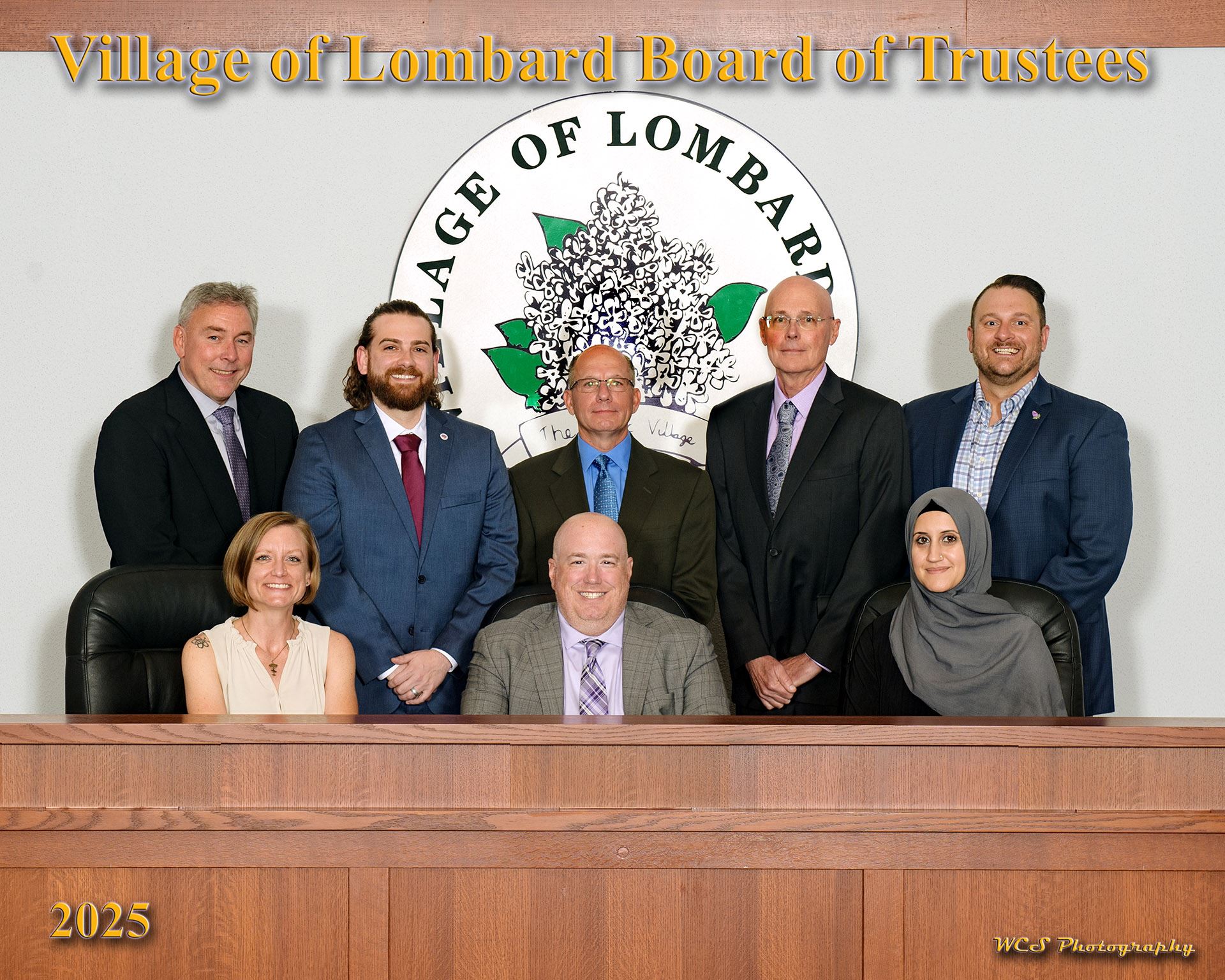 Members of the board of trustees sitting in the board room