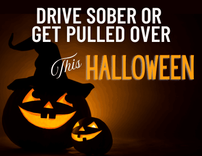 lit up jackolantern with dark background and drive sober or get pulled over text 