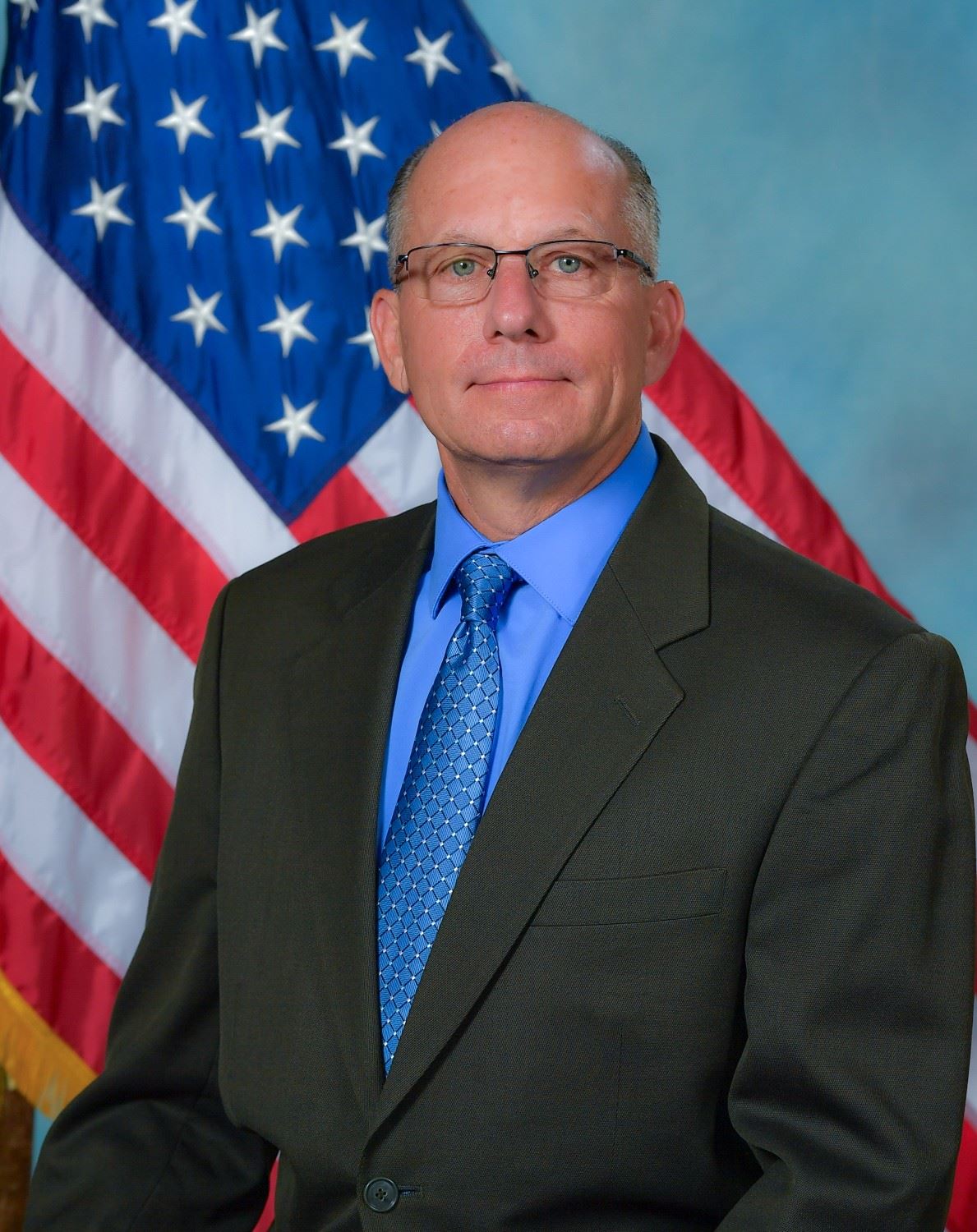 Headshot of Trustee Bob Bachner with US flag in background